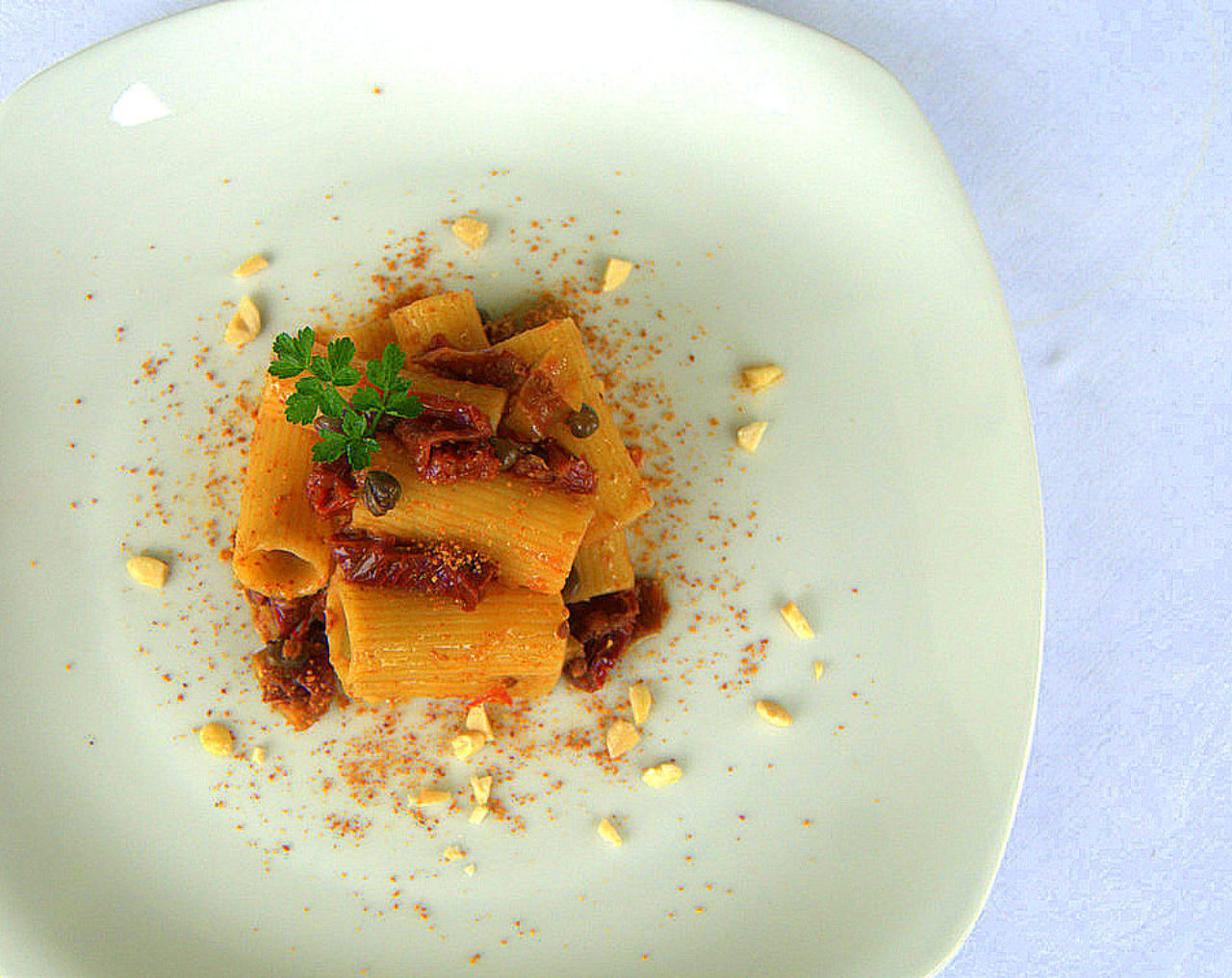 Rigatoni with sun-dried tomatoes, capers, olives and almonds