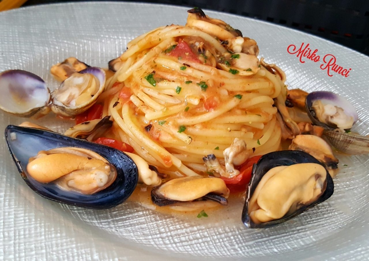 Spaghetti with mussels, clams and baby tomatoes