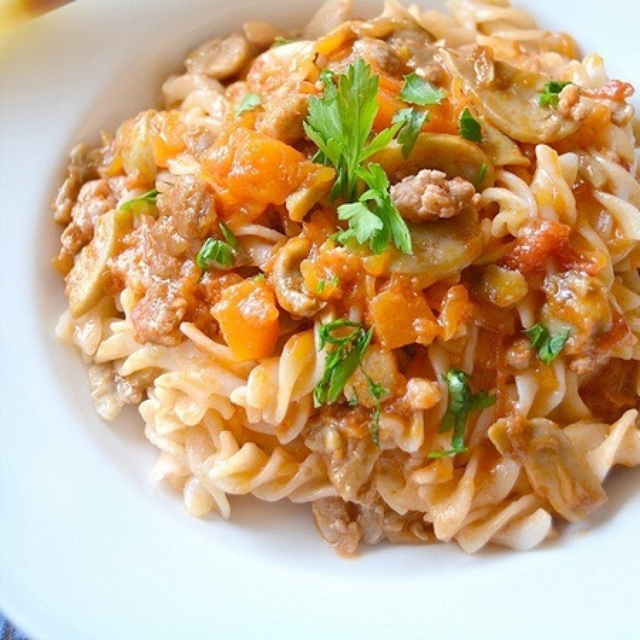 Fusilli with pumpkin, sausage and mushrooms sauce