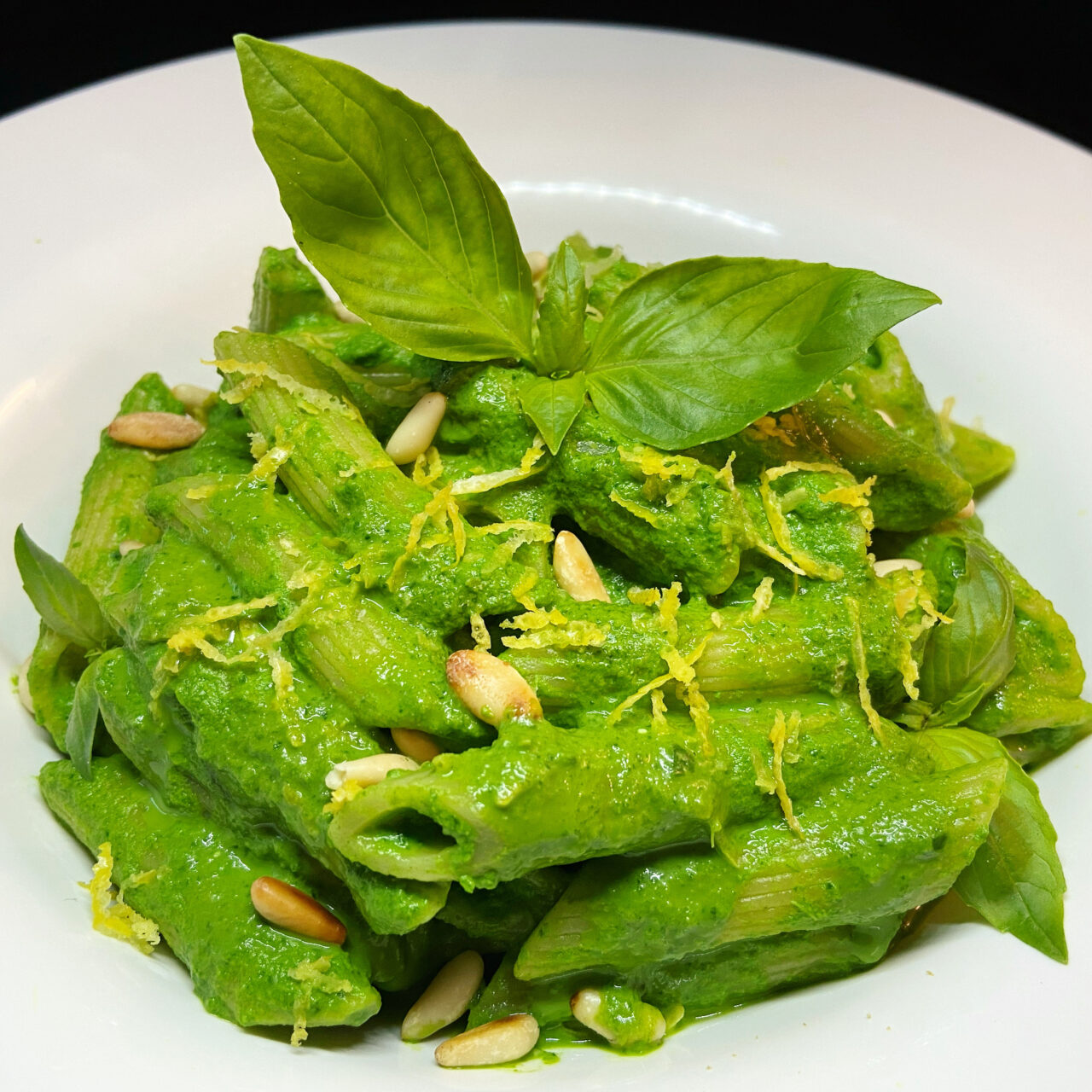 Pennette with cream of baby spinach, ricotta cheese, lemon and toasted pine nuts