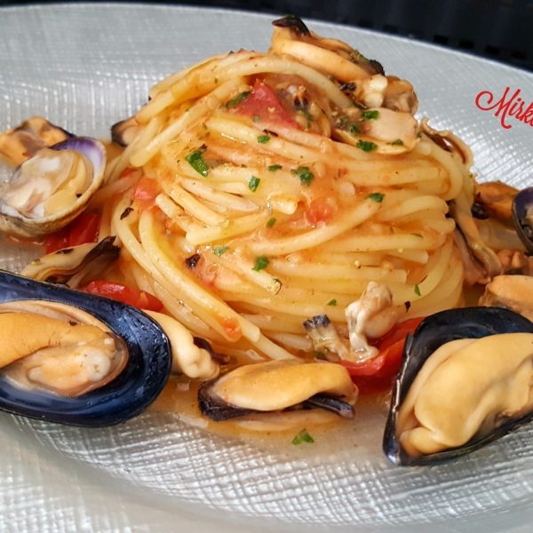 Spaghetti with mussels, clams and baby tomatoes