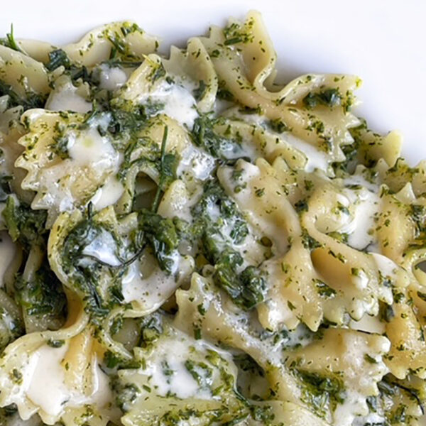 Farfalle al pesto di agretti e fonduta di taleggio